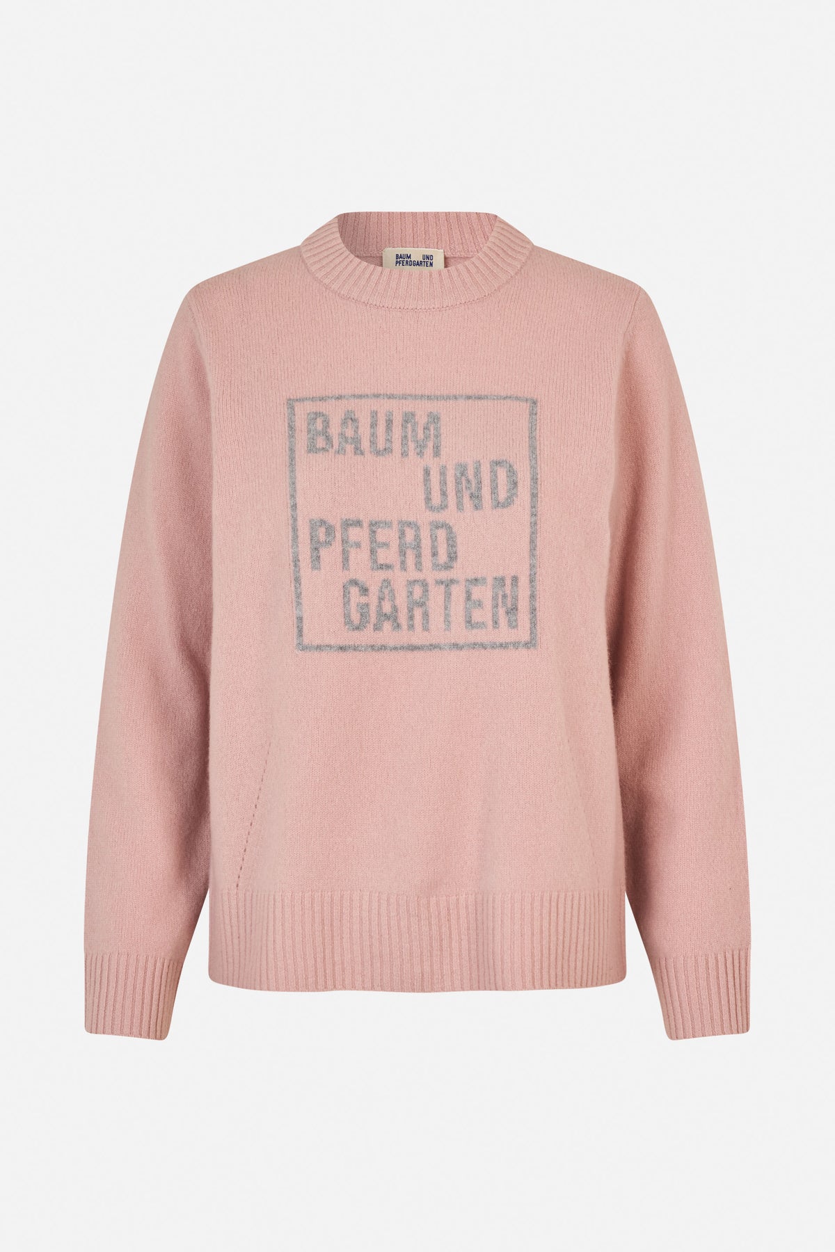 Pink long-sleeved knit sweater with a ribbed crew neck, cuffs and hem, featuring a large grey Baum und Pferdgarten logo on the front.