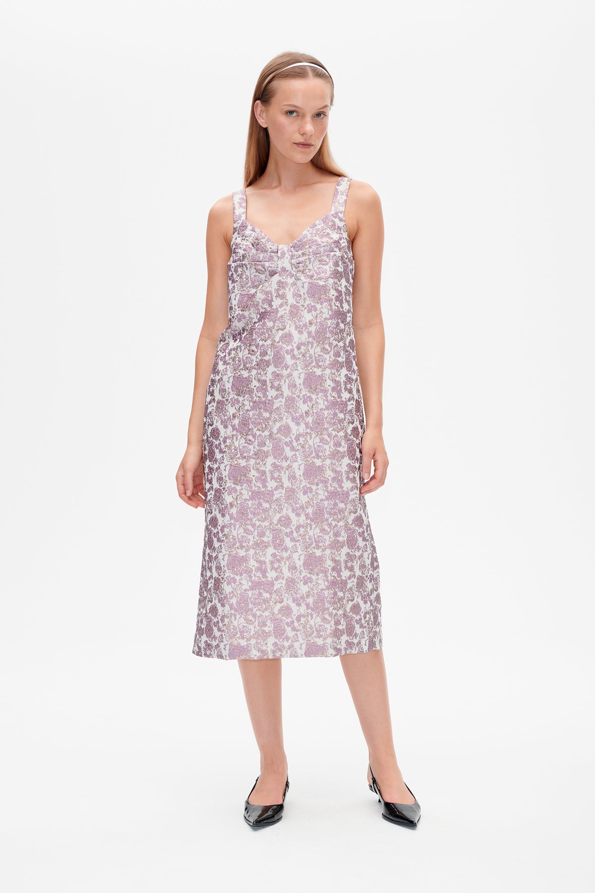 Front view of a sleeveless, square-neck midi dress with a white and lilac floral pattern and fitted bodice.