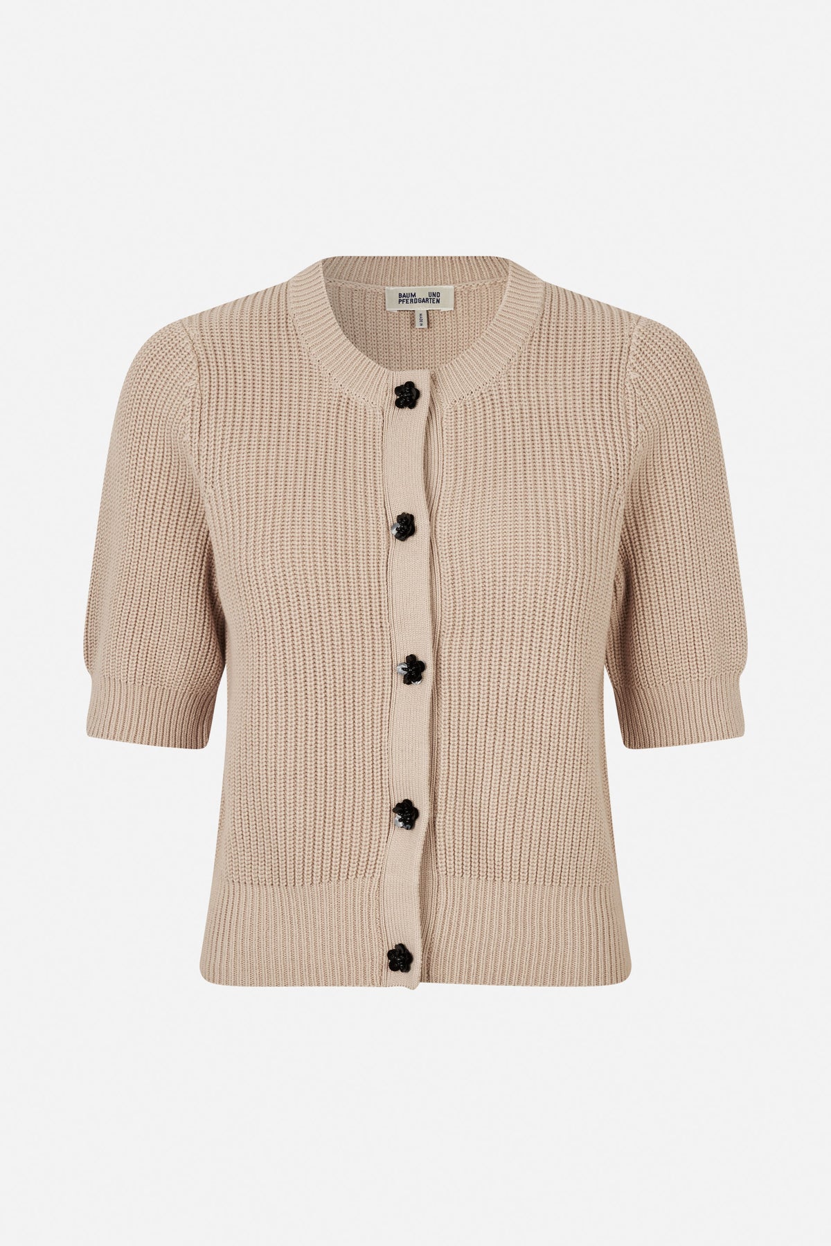 Front view of a beige knitted cardigan with a round neckline, short puff sleeves and black flower-shaped buttons.