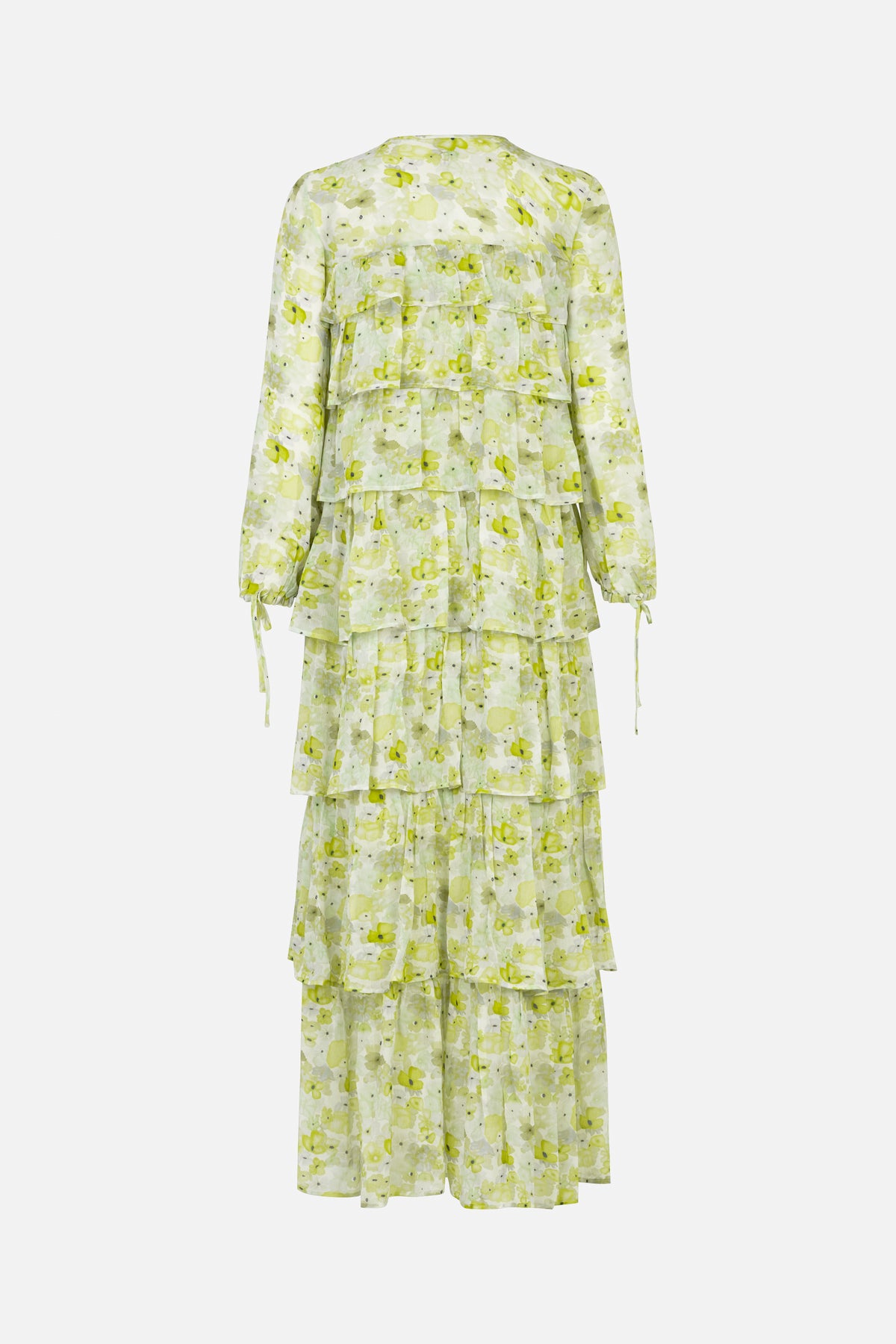Back view of a long-sleeved tiered maxi dress with a pale green and white floral print and tie-cuff details.