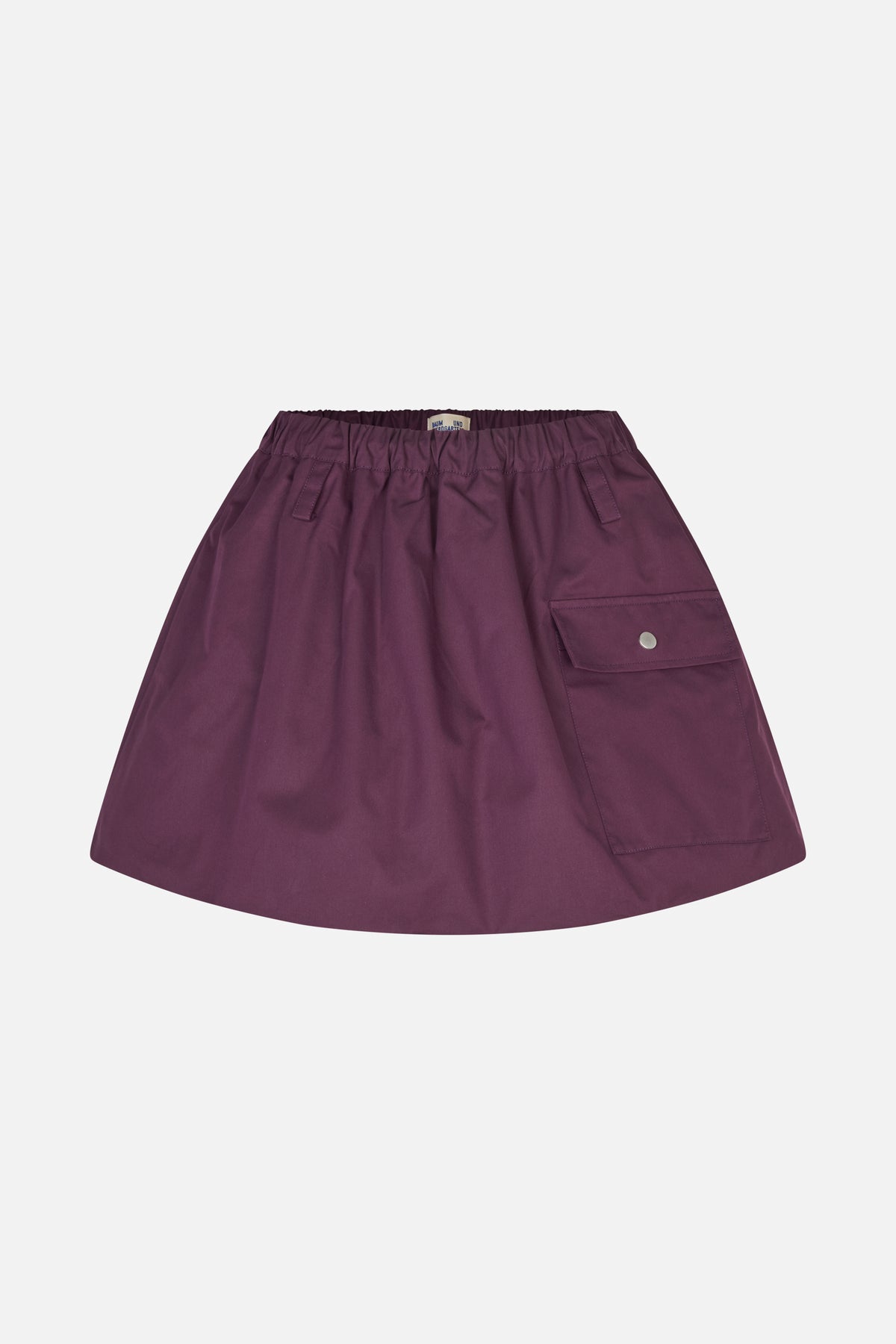Front view of a plum A-line skirt with a gathered elastic waistband, slanted pockets and a flap cargo pocket.