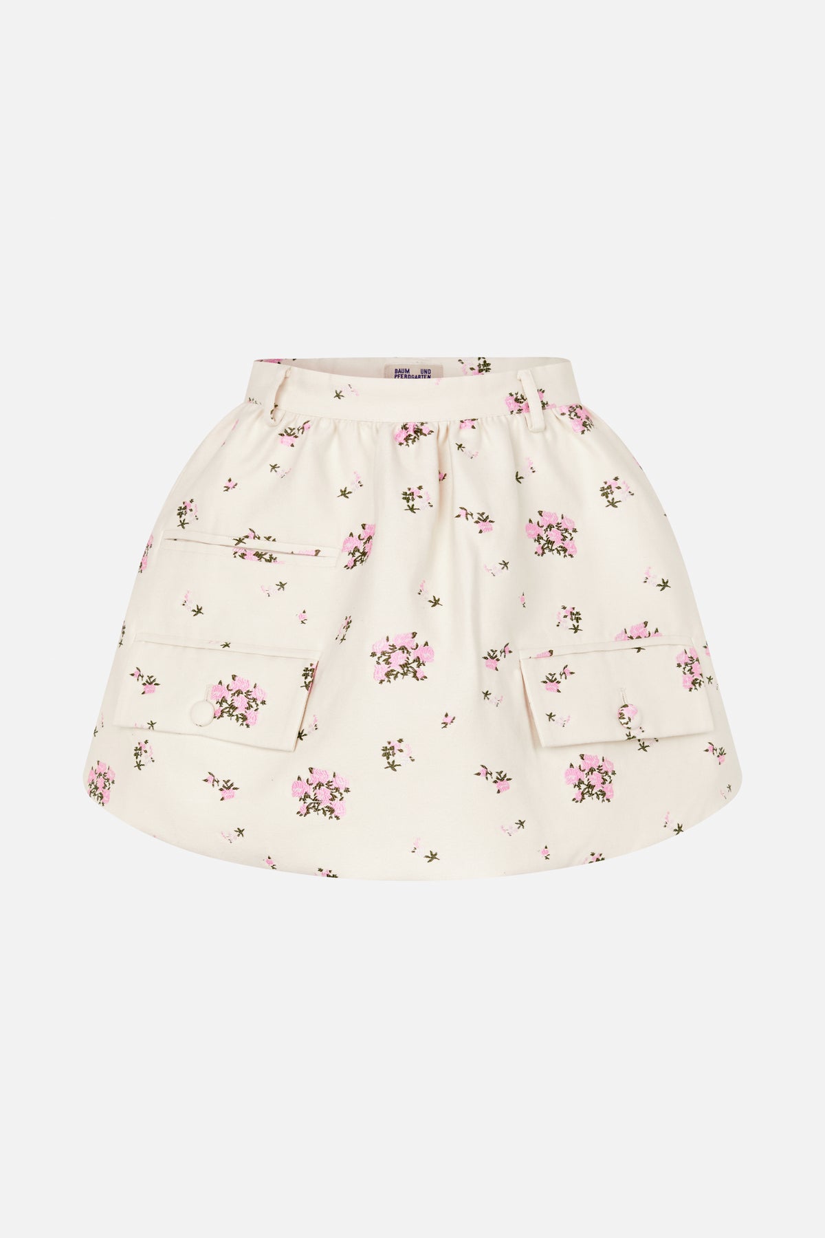 Front view of an ivory flared skirt with scattered pink floral print, belt loops, and large buttoned patch pockets.