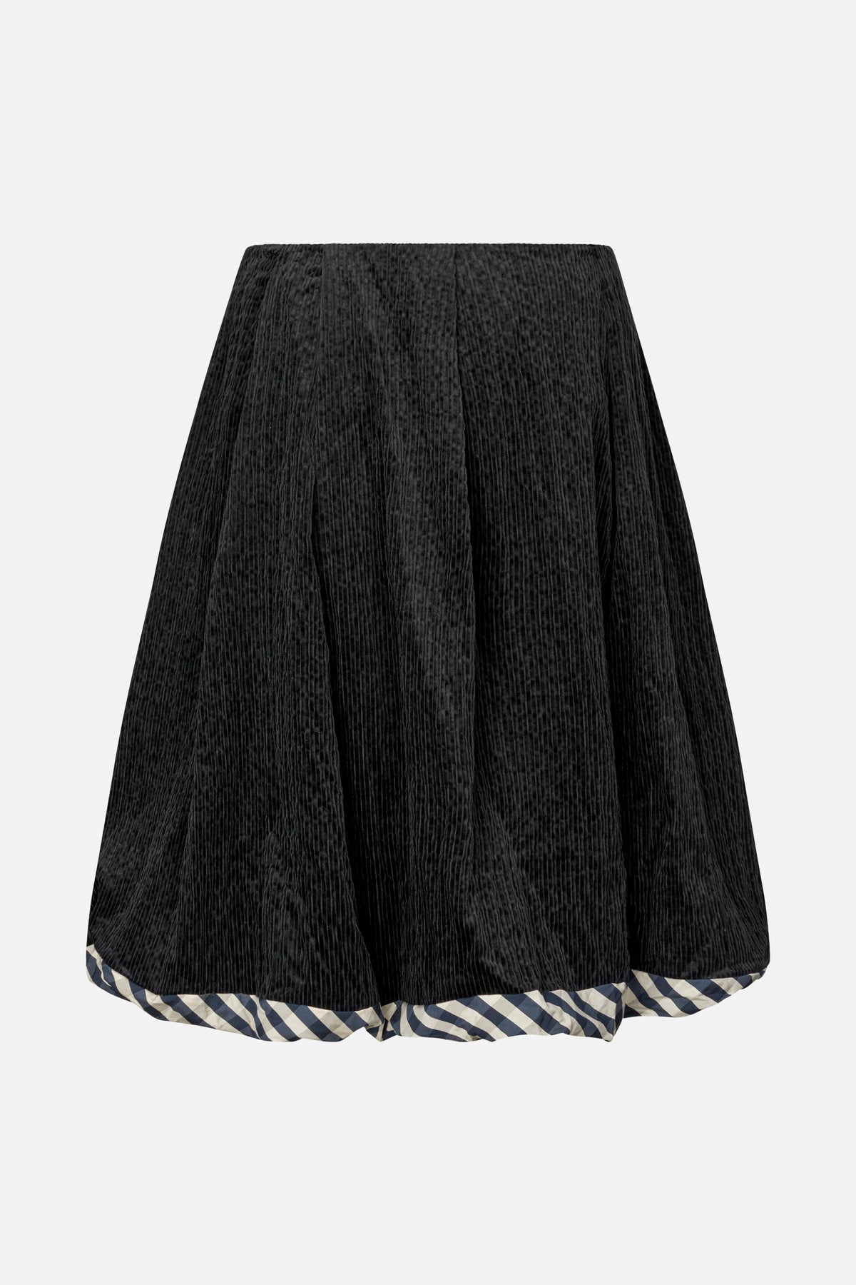Front view of a black ribbed flared skirt with navy and cream checked trim at the hem