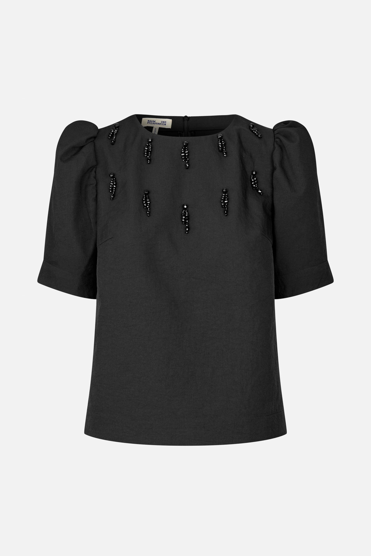 Front view of a black short-sleeved top with puff shoulders, a round neckline and scattered black beaded embellishments.