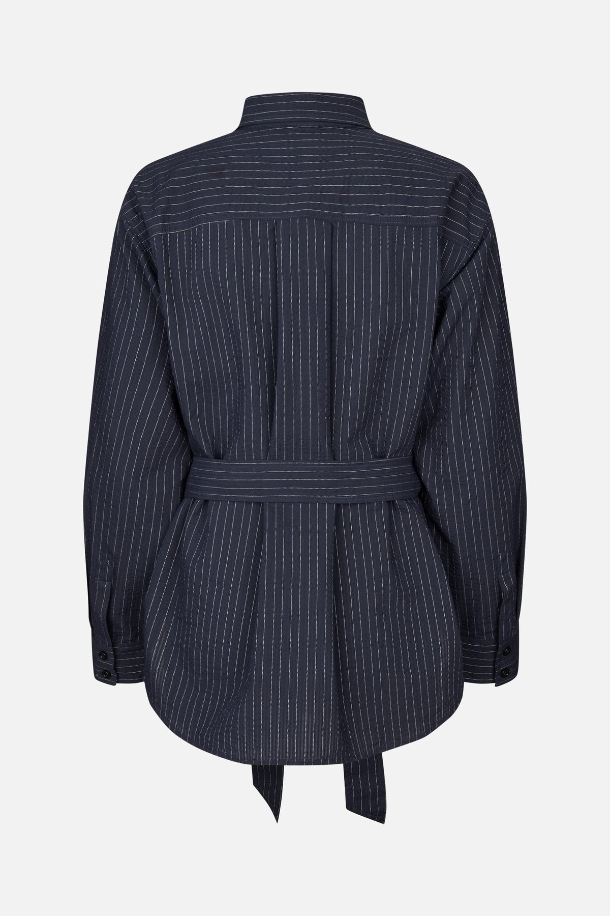 Back view of a dark navy pinstriped shirt dress with long sleeves, a waist tie and a curved hem.