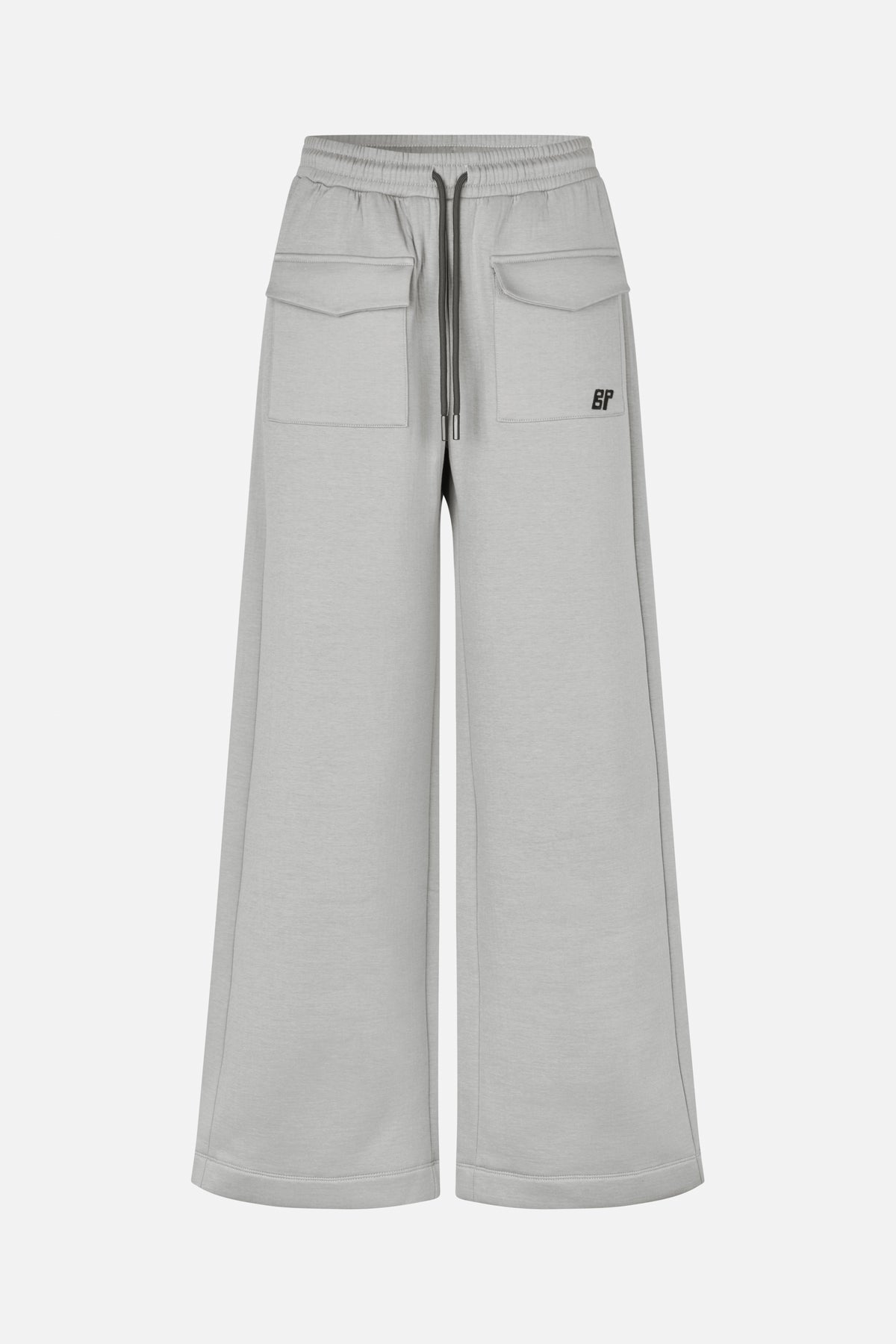Front view of light grey wide-leg sweatpants with an elastic drawstring waist and large flap pockets.