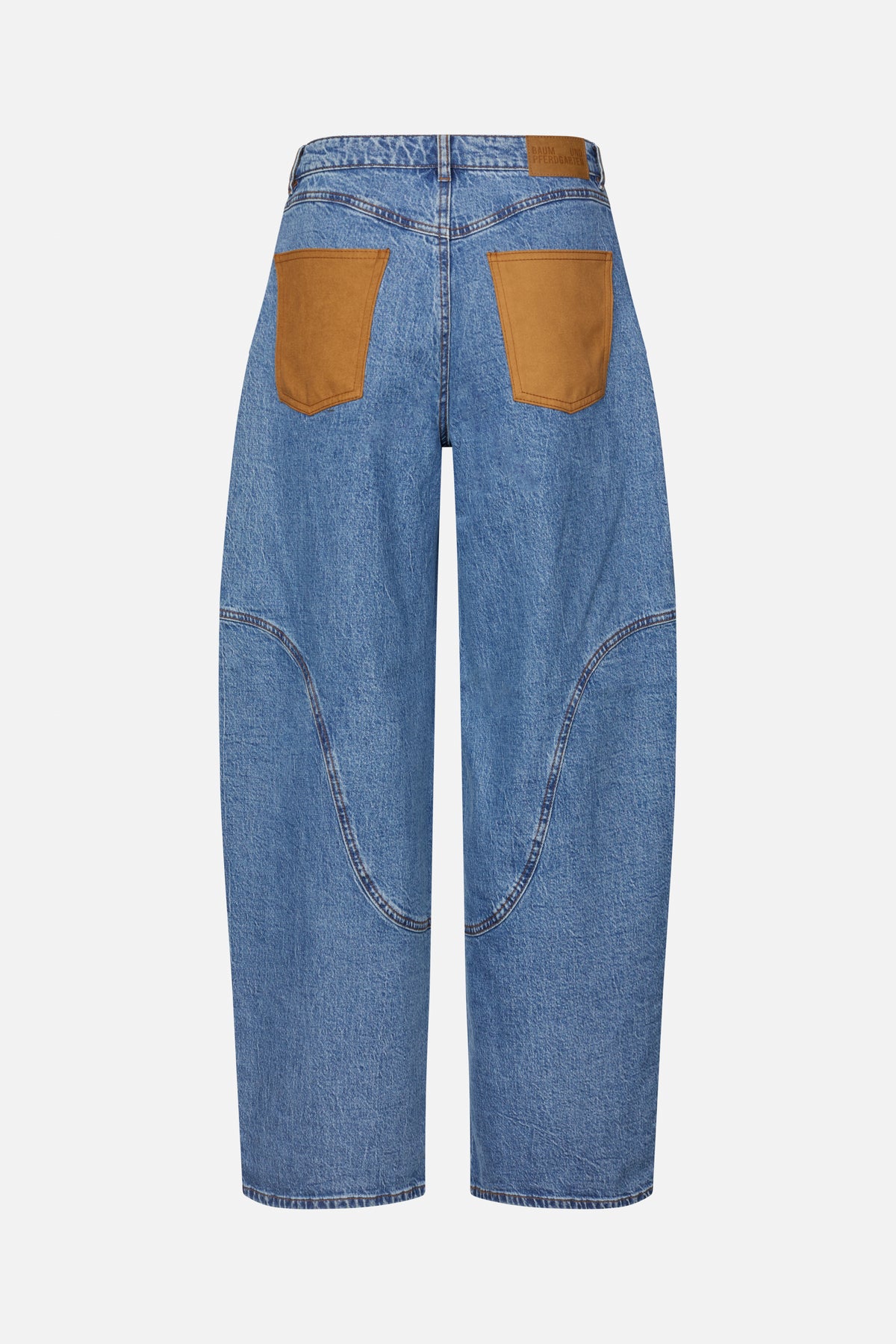 Back view of wide-leg blue denim jeans with oversized tan patch pockets and curved knee seam panels.