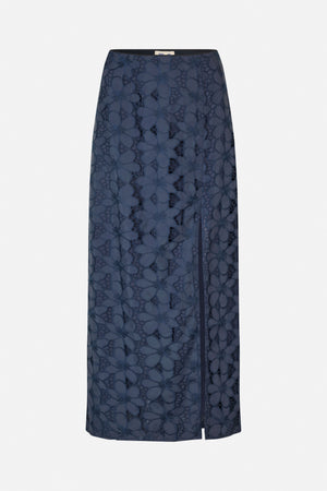 Front view of a dark navy midi skirt with oversized floral lace, a black waistband and a front slit.