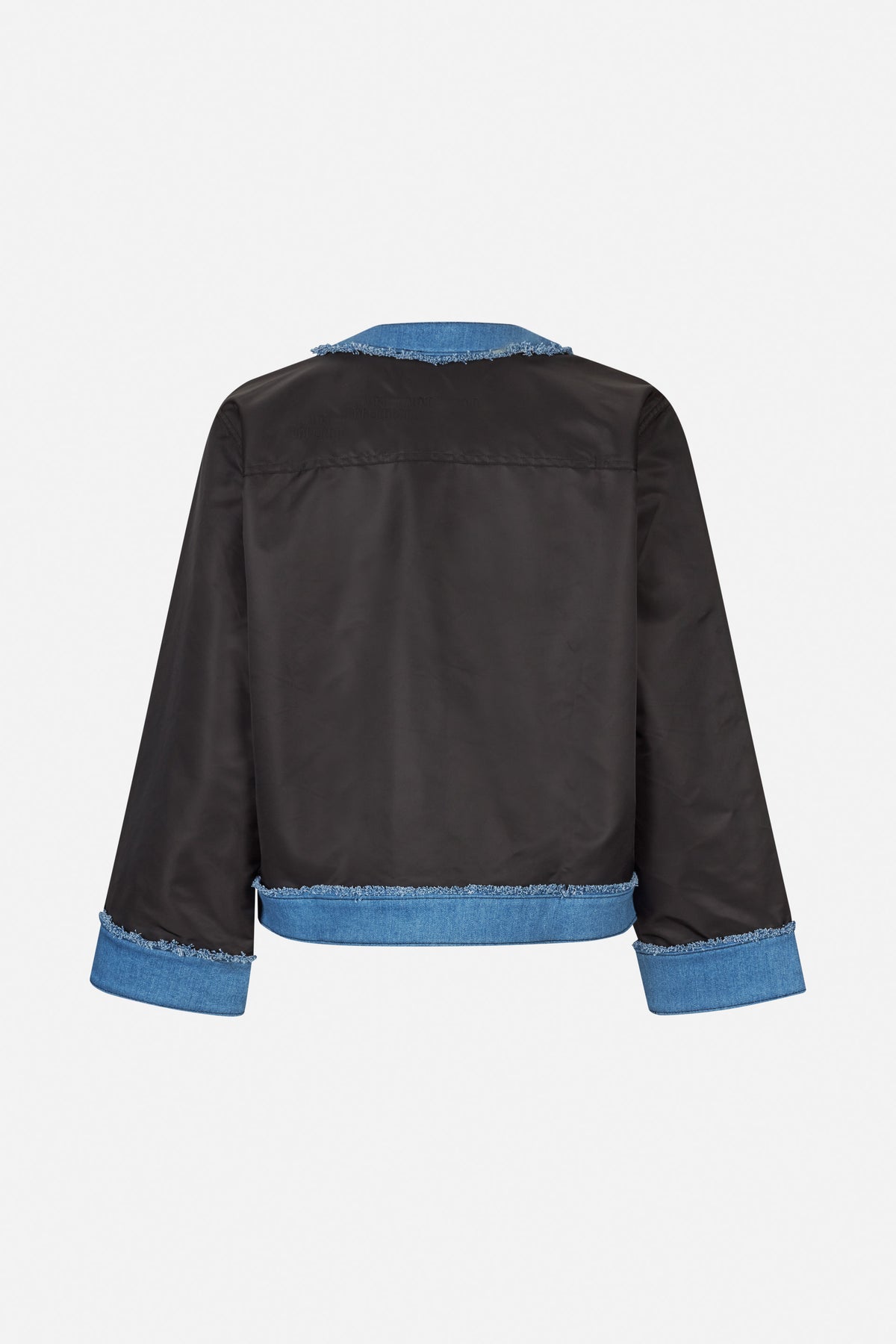 Back view of a black jacket with blue denim collar, hem and cuffs, finished with frayed edges.