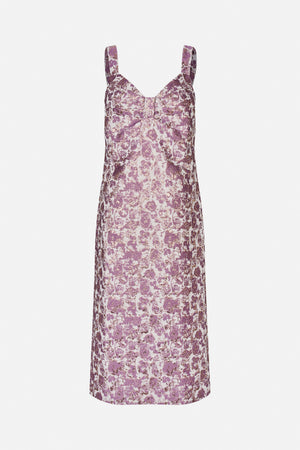 Front view of a sleeveless dress with wide straps, a V-neck and a purple floral pattern on a pale pink ground.