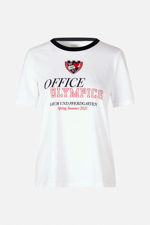 White short-sleeve T-shirt with black crew neck and a red-and-black front graphic reading “Office Olympics” and “Spring Summer 2025”.