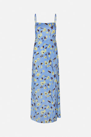 Front view of a long blue slip dress with adjustable spaghetti straps and an all-over yellow and dark brown floral print.