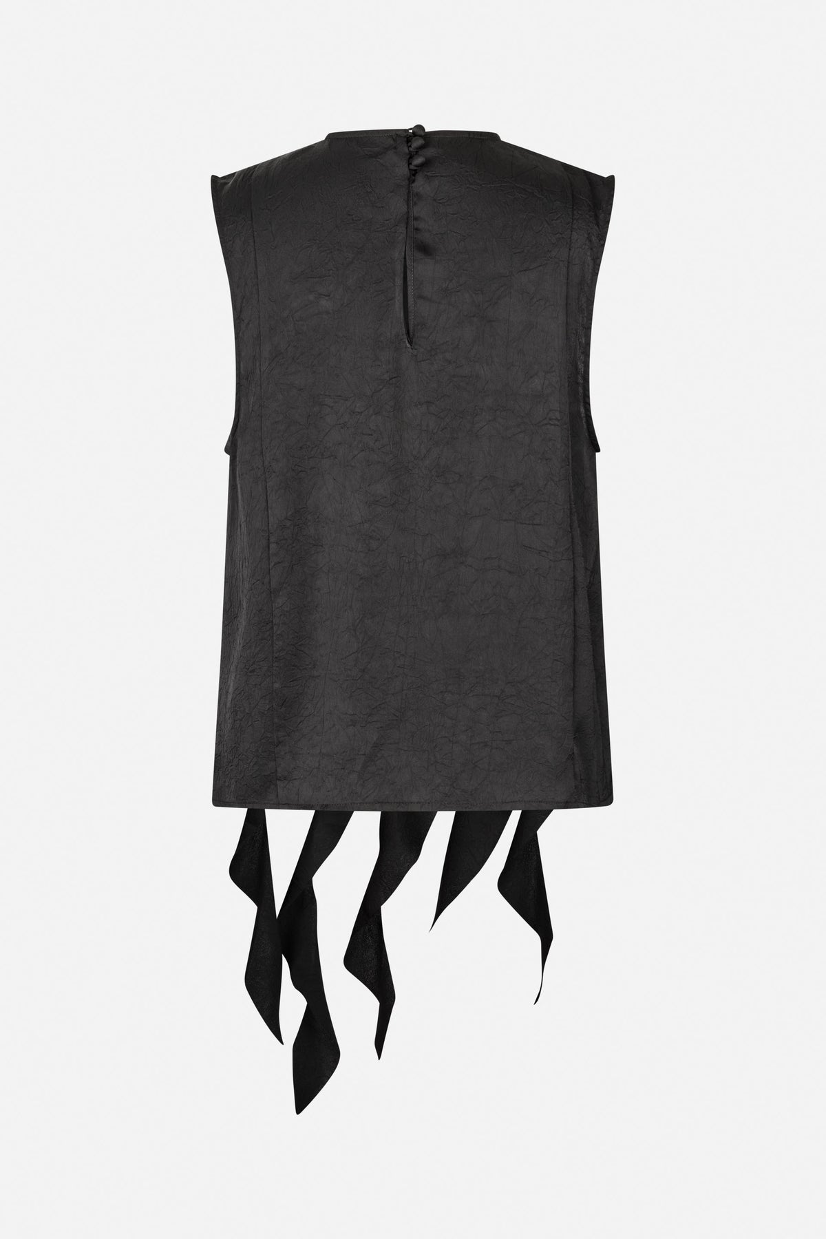 Back view of a black sleeveless tunic with a crinkled texture, high neckline, fabric-covered buttons, and long hanging fabric ties.