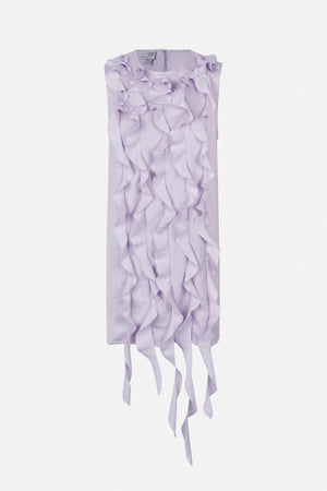 Front view of a pale lilac sleeveless dress with cascading sculptural ruffles and long trailing fabric strips at the hem.