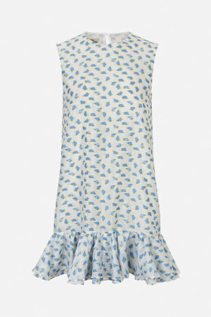 Front view of a white sleeveless dress with a scattered blue and green floral print and a gathered ruffle hem.