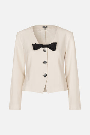 Front view of an ivory tailored jacket with a deep V-neck, three dark buttons and a black bow detail
