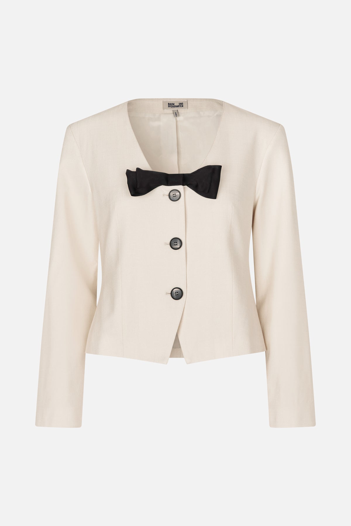 Front view of an ivory tailored jacket with a deep V-neck, three dark buttons and a black bow detail
