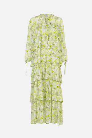 Front view of a long-sleeved, tiered dress with a pale green and white floral print, ruffled panels and a tie neckline.
