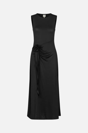 Front view of a black sleeveless dress with a round neckline, diagonal seam, and gathered hip detail with a fabric rosette and long hanging tie.