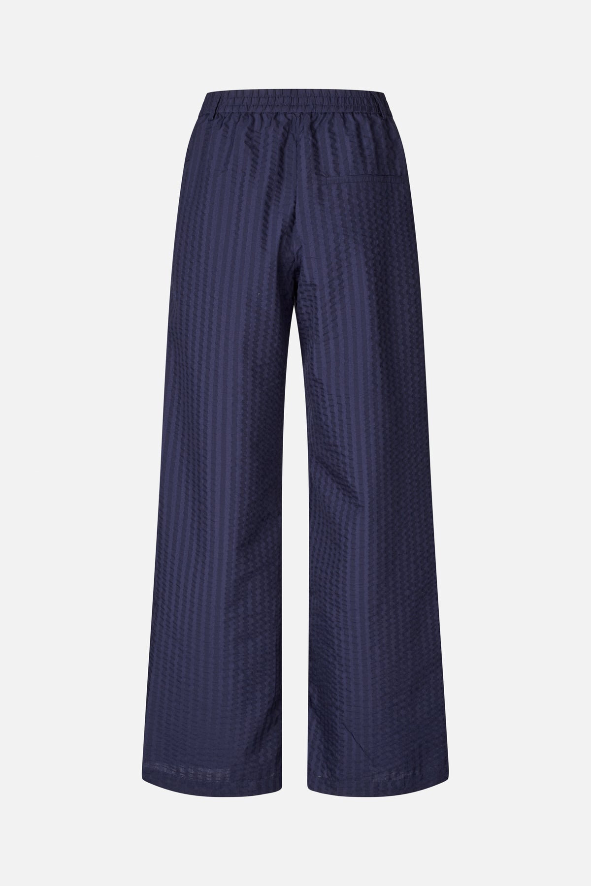 Back view of navy wide-leg trousers with an elasticated waistband, subtle vertical textured stripes and a single back pocket.