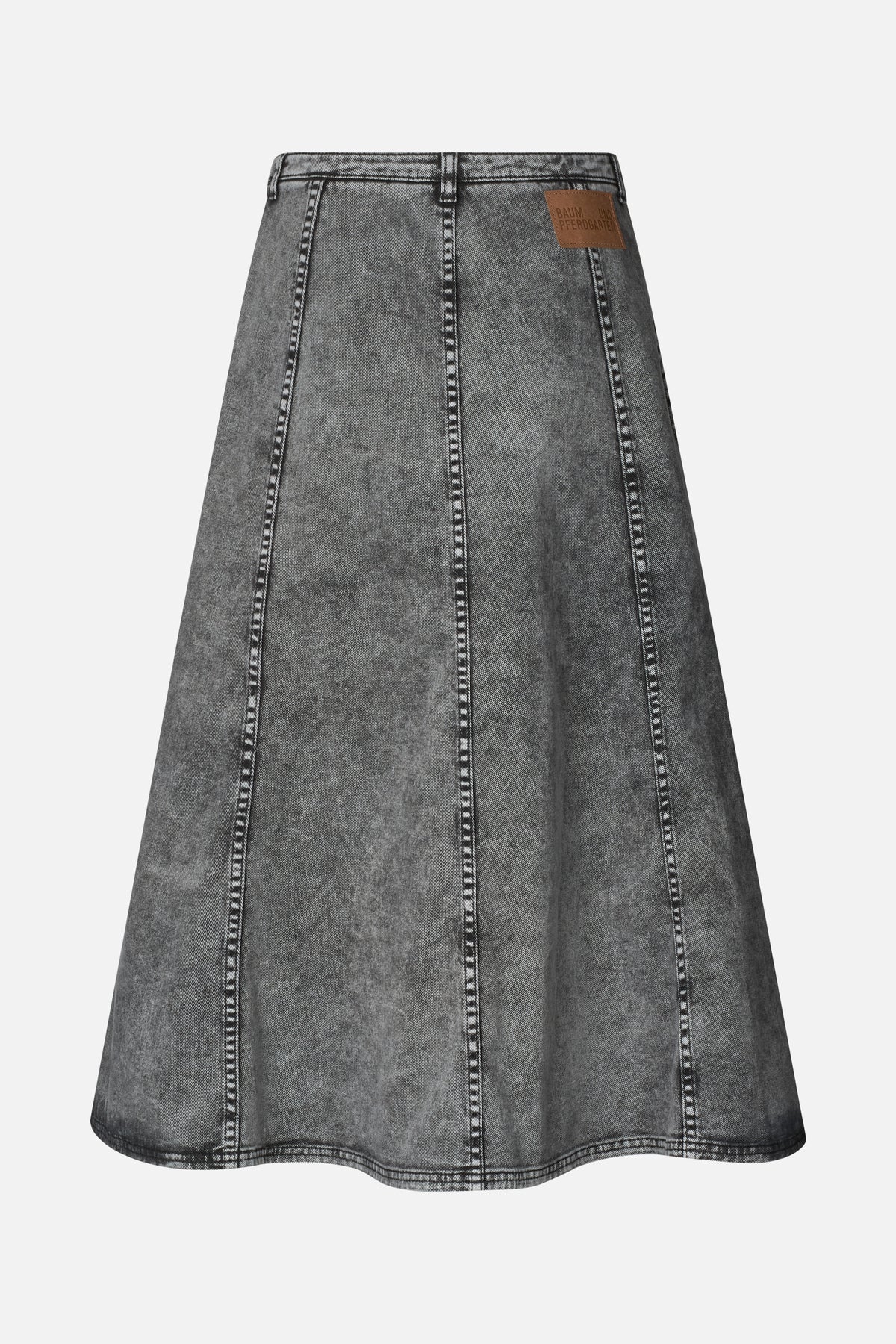 Back view of a charcoal grey washed denim A-line skirt with vertical panel seams, belt loops and a tan waistband patch.