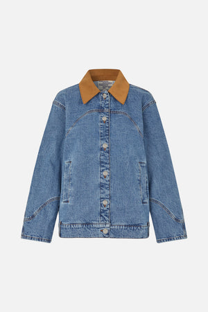 Front view of a blue washed denim jacket with a contrasting tan pointed collar, logo buttons and curved seam detailing.