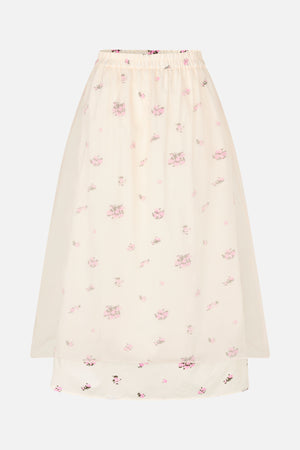 Ivoorkleurige transparante rok met elastische tailleband, een verspreide roze- en grijze bloemenprint en een kortere ondoorzichtige voering