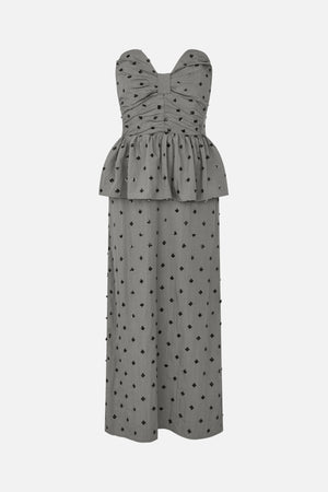 Front view of a grey strapless floor-length dress with a gathered bow-shaped bodice, peplum overlay and scattered black floral embellishments.