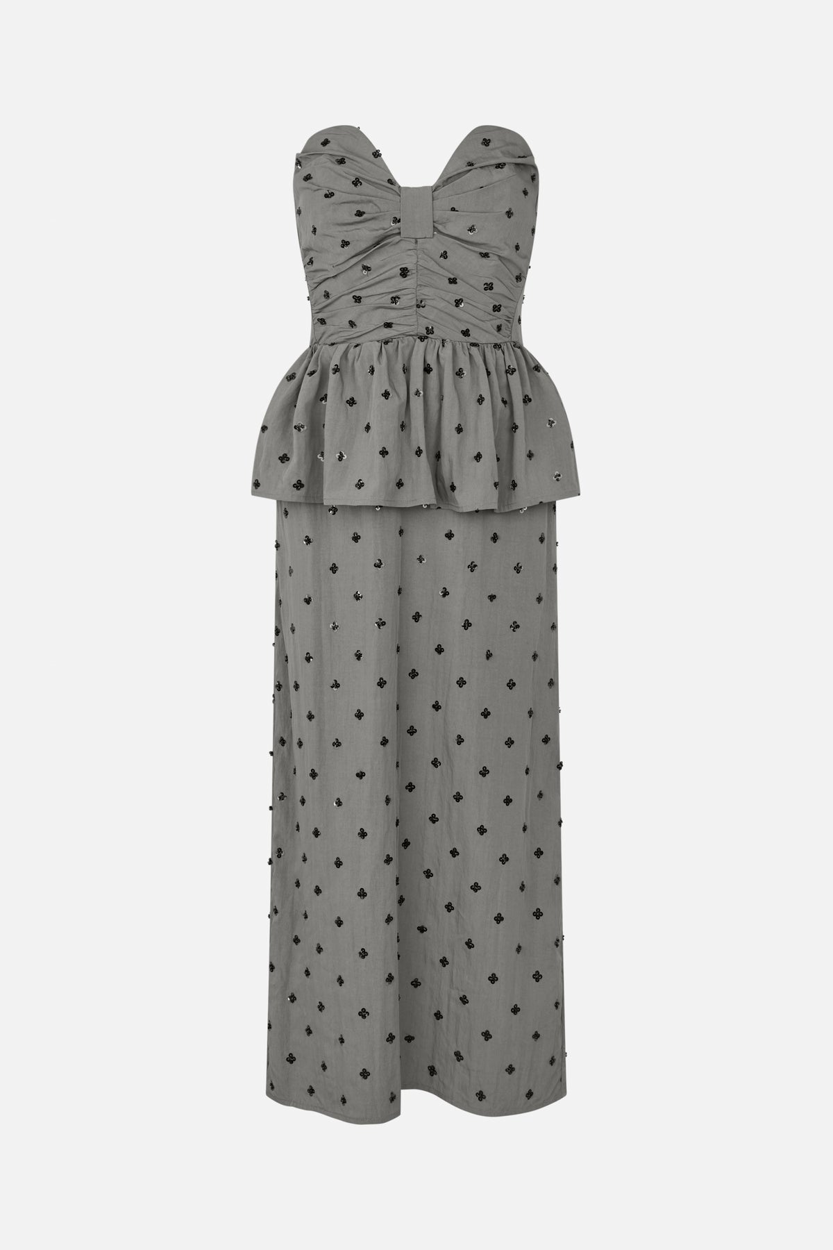 Front view of a grey strapless floor-length dress with a gathered bow-shaped bodice, peplum overlay and scattered black floral embellishments.