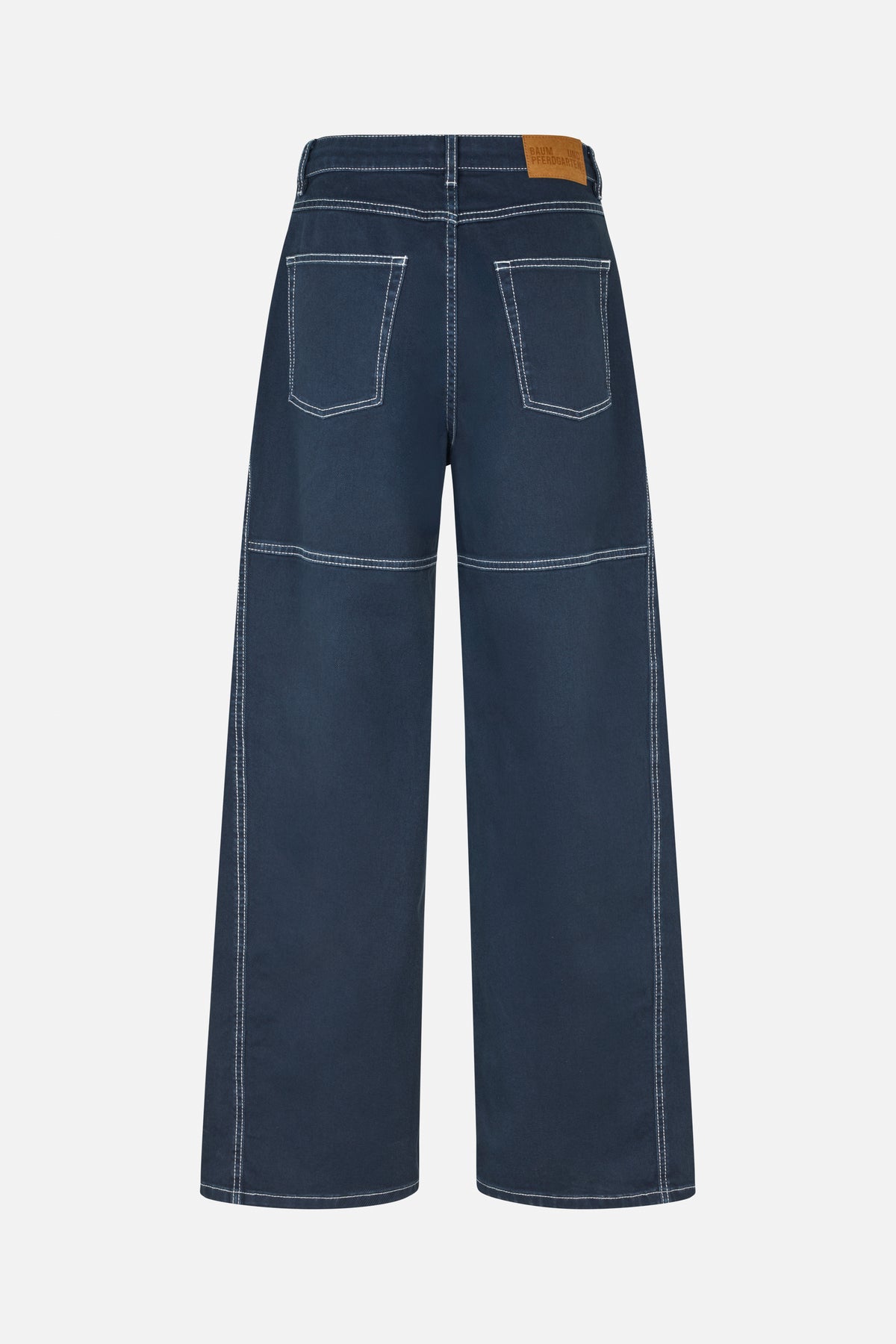 Back view of dark blue wide-leg jeans with contrast white stitching, two rear pockets and a tan waistband patch.