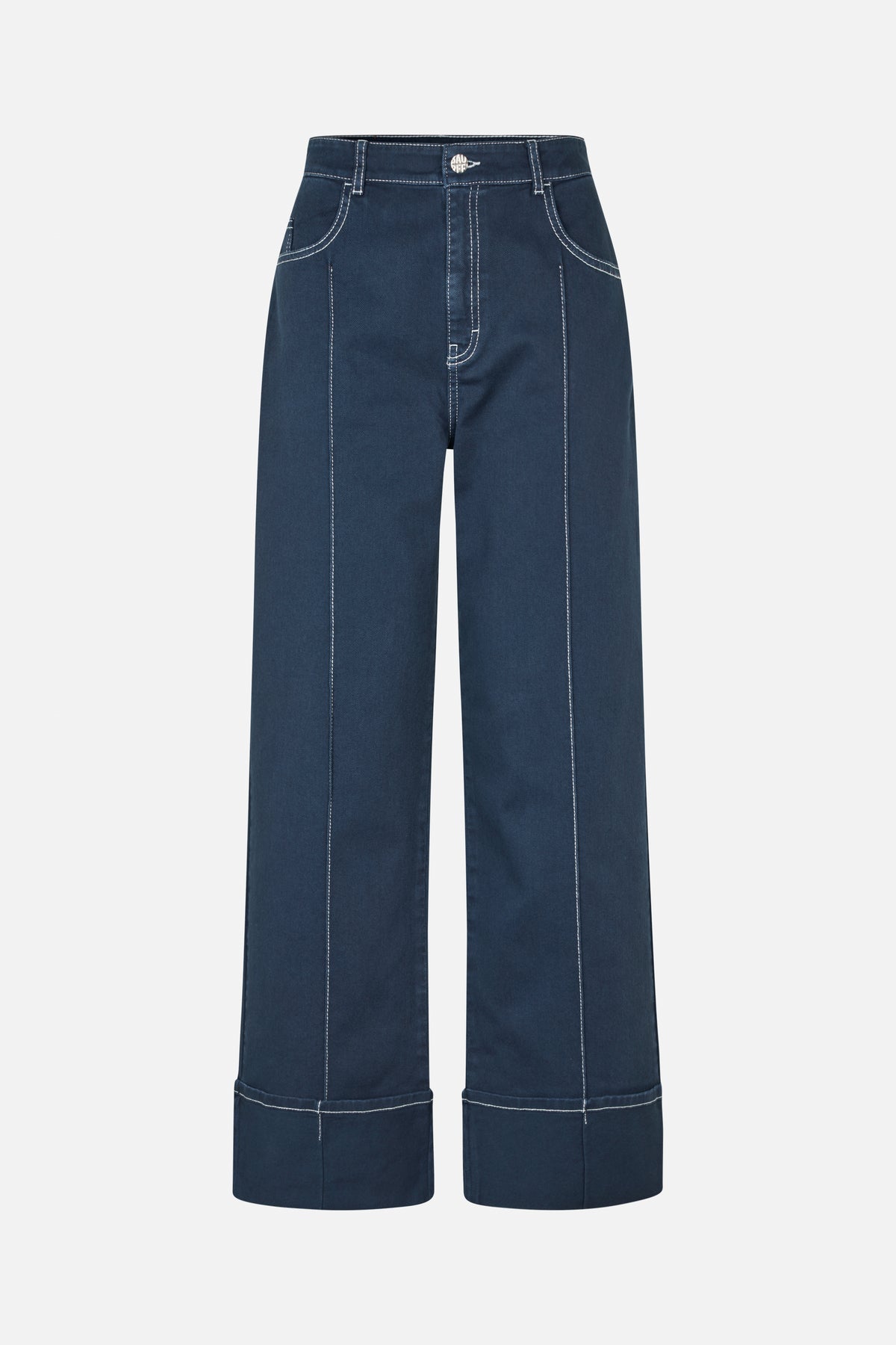 Front view of dark indigo wide-leg jeans with contrasting white topstitching, curved front pockets and oversized cuffed hems.