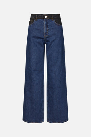 Front view of dark blue wide-leg jeans with black contrast denim at the waistband and pockets, gold stitching, and a button closure.