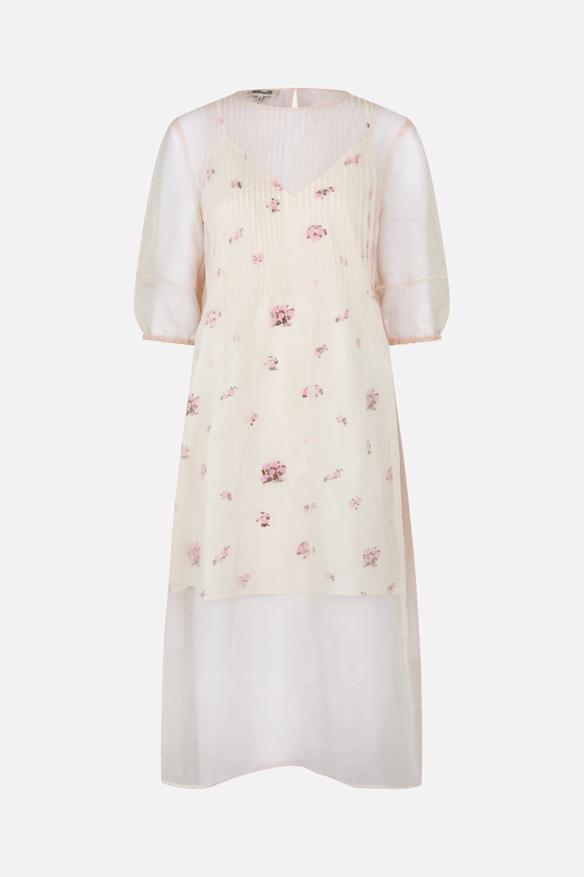 Front view of an ivory sheer dress with scattered pink floral print, a pleated bodice, and three-quarter puff sleeves.