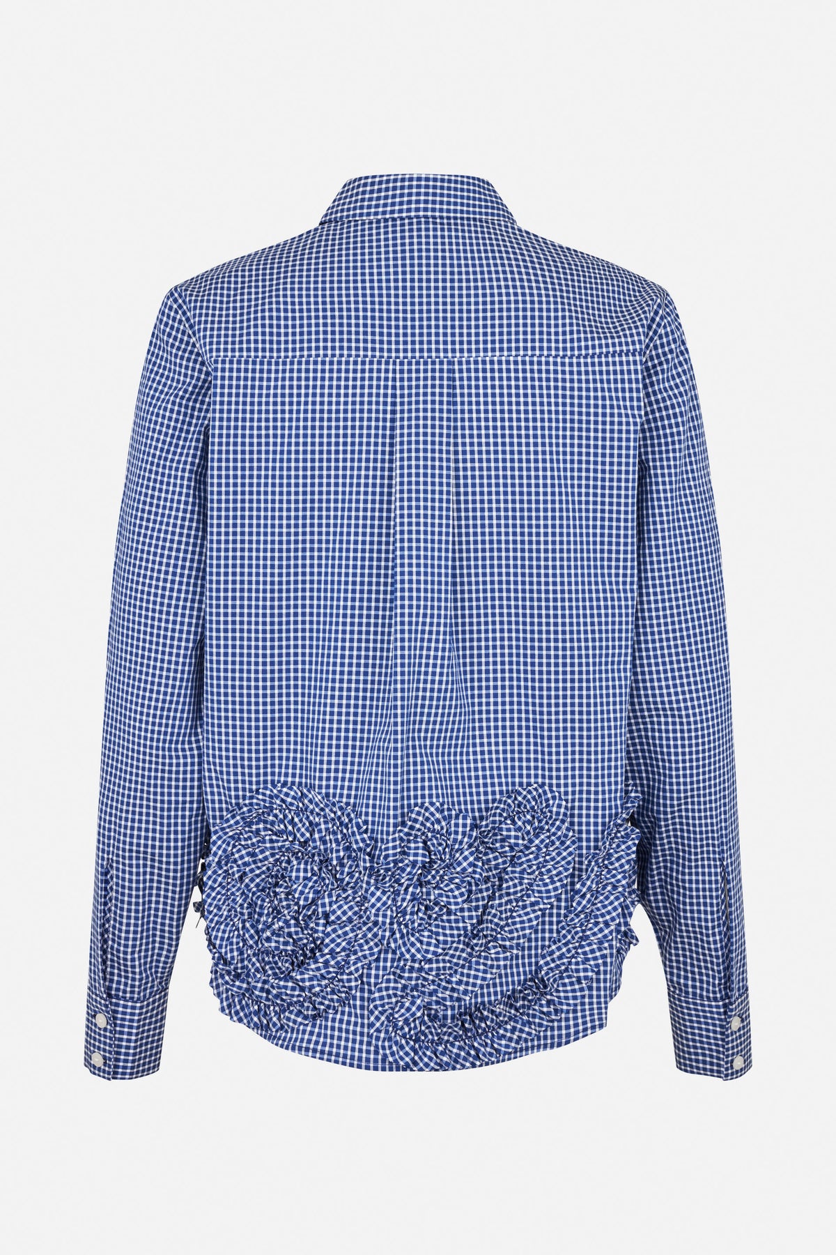 Back view of a blue and white gingham long-sleeve shirt with a pointed collar, button cuffs and gathered ruffles across the lower back.