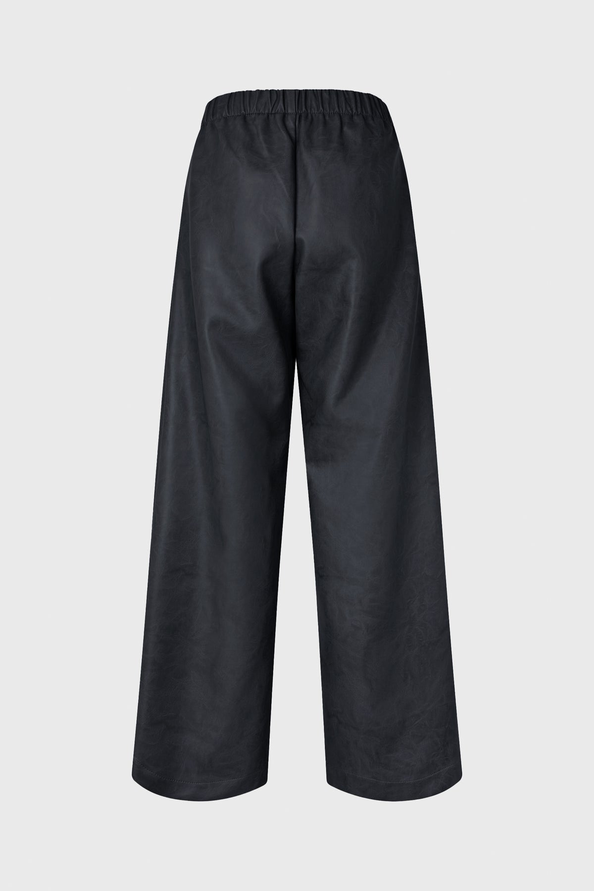 Back view of wide-leg black trousers with an elasticated waistband and subtle marbled texture.