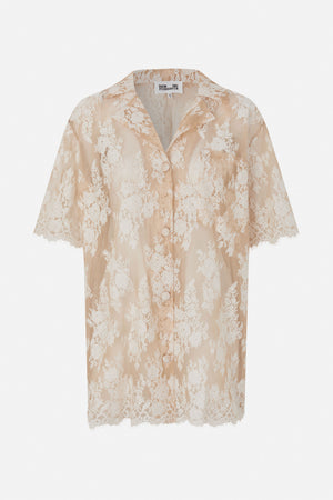 Front view of a short-sleeved, button-front shirt in sheer beige lace with an all-over white floral pattern.